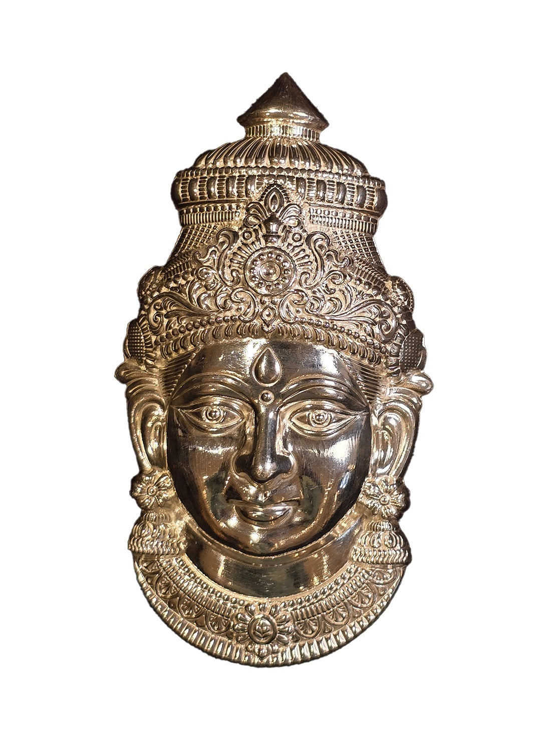 Silver mukham idol for pooja, close view of engraved deity face with crown.