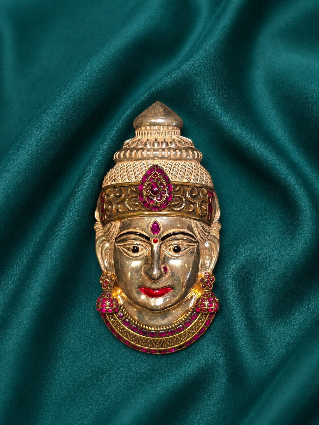Silver Lakshmi idol face with pink gemstone detailing and ornate crown