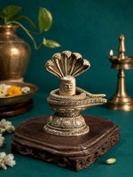 Silver-toned Shiva lingam ornament with cobra coil (Naag) detail on oval base