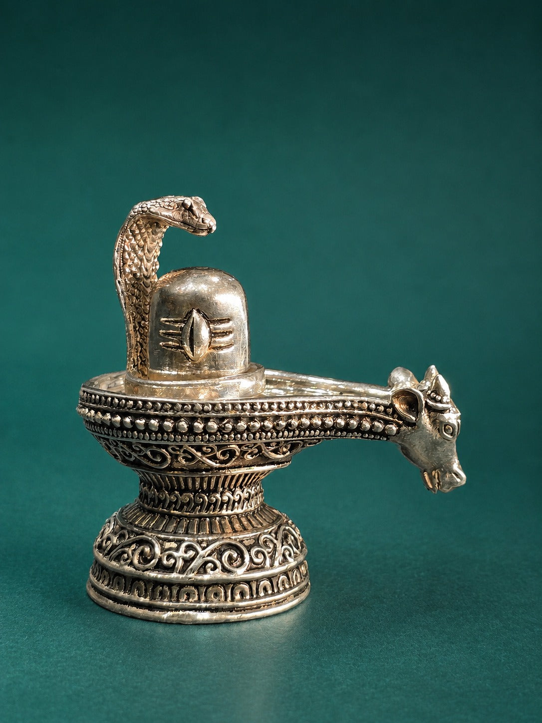 Silver Shiva lingam figure with cobra hood and Nandi on side, patterned base