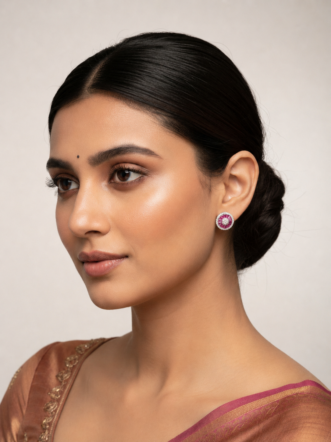 Shop pair of round silver earrings for womens with pink gemstones and diamond-like elements.
