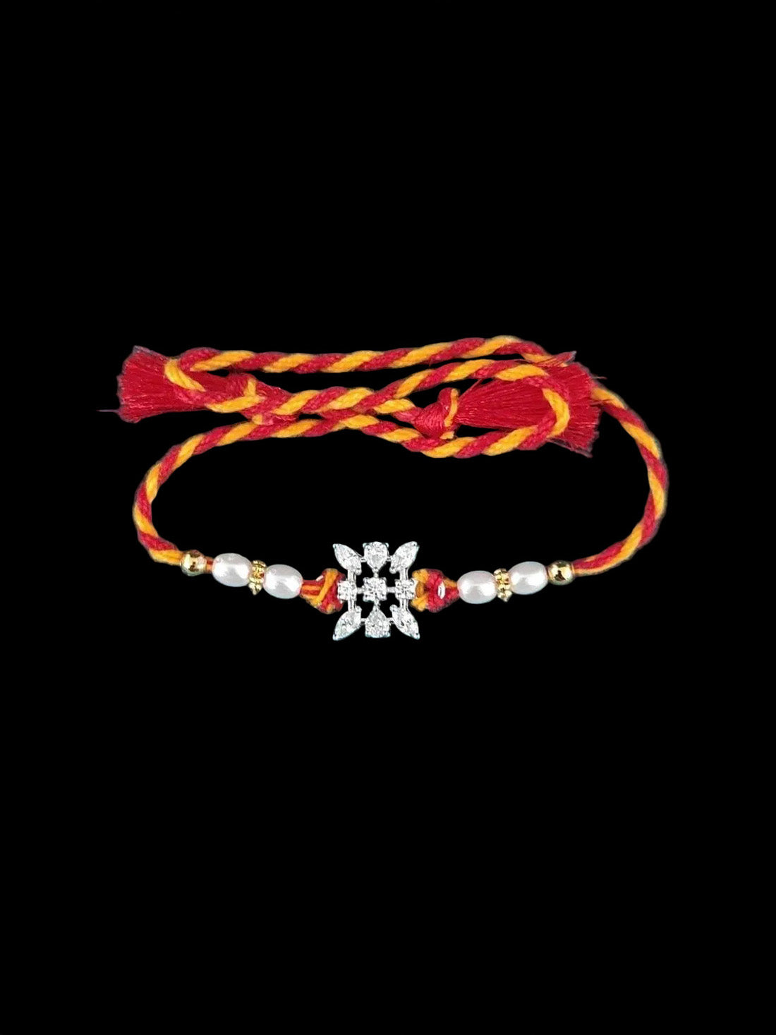 Sterling silver floral rakhi with pearl beads on red-yellow braided thread