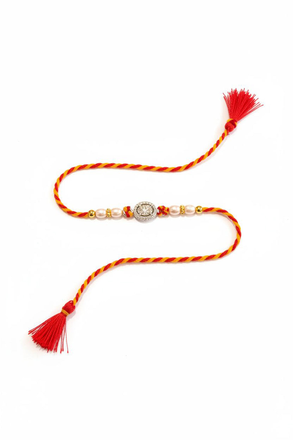 Oval silver rakhi with pearl beads, red-orange striped thread and tassels