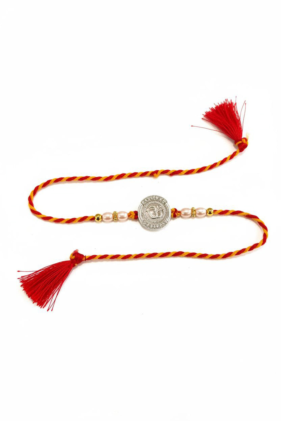 Braided red-and-orange thread rakhi with silver Om disc, pearl beads, red tassel