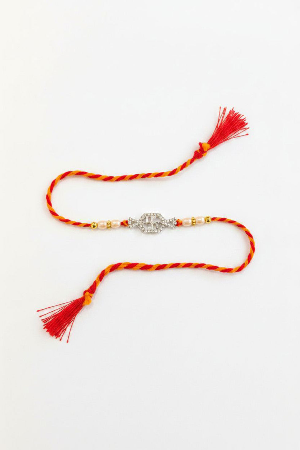 92.5 sterling silver swastik rakhi with pearl beads and red braided thread