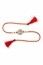 Sterling silver rakhi with round halo pendant, pearl beads, red thread and tassels