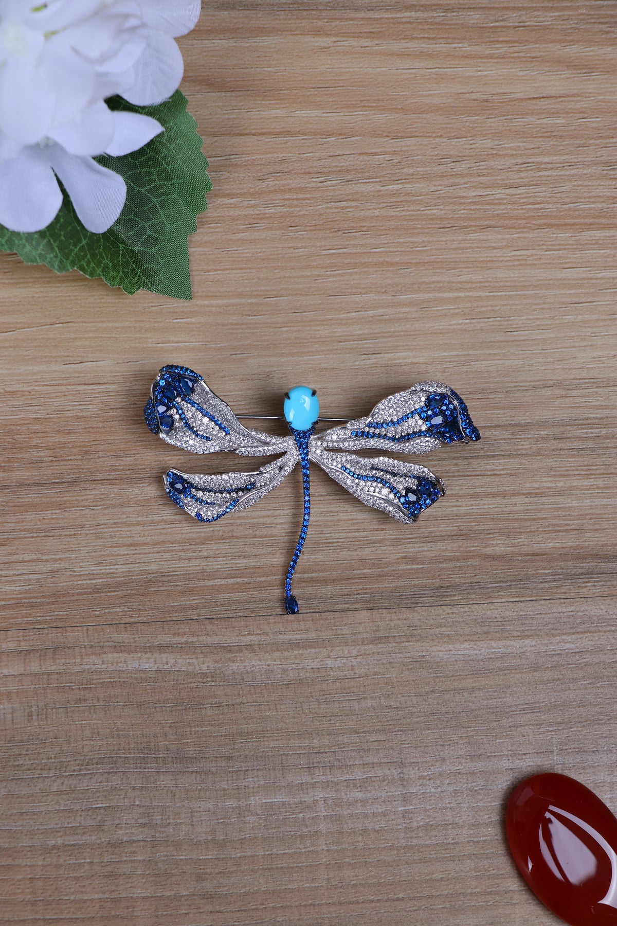 Blue and silver ribbon bow rhinestone brooch with light-blue center bead