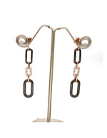 Buy women’s silver drop earrings with black geometric links and a rose-gold finish online.