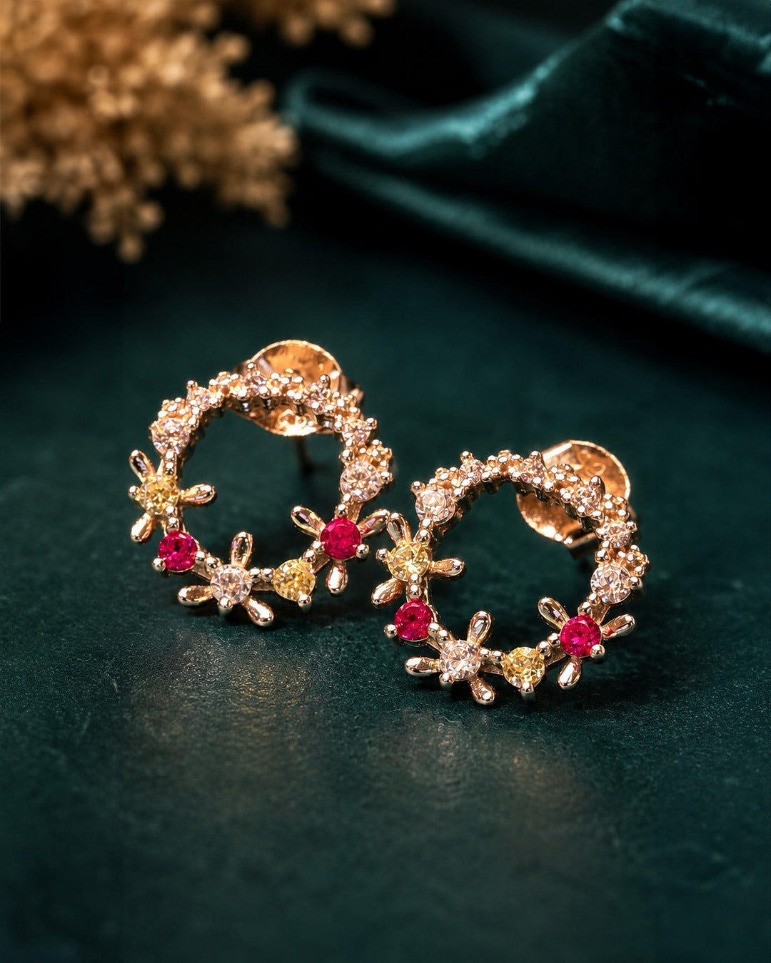 Buy women’s floral silver stud earrings with red, yellow and clear crystal stones online.