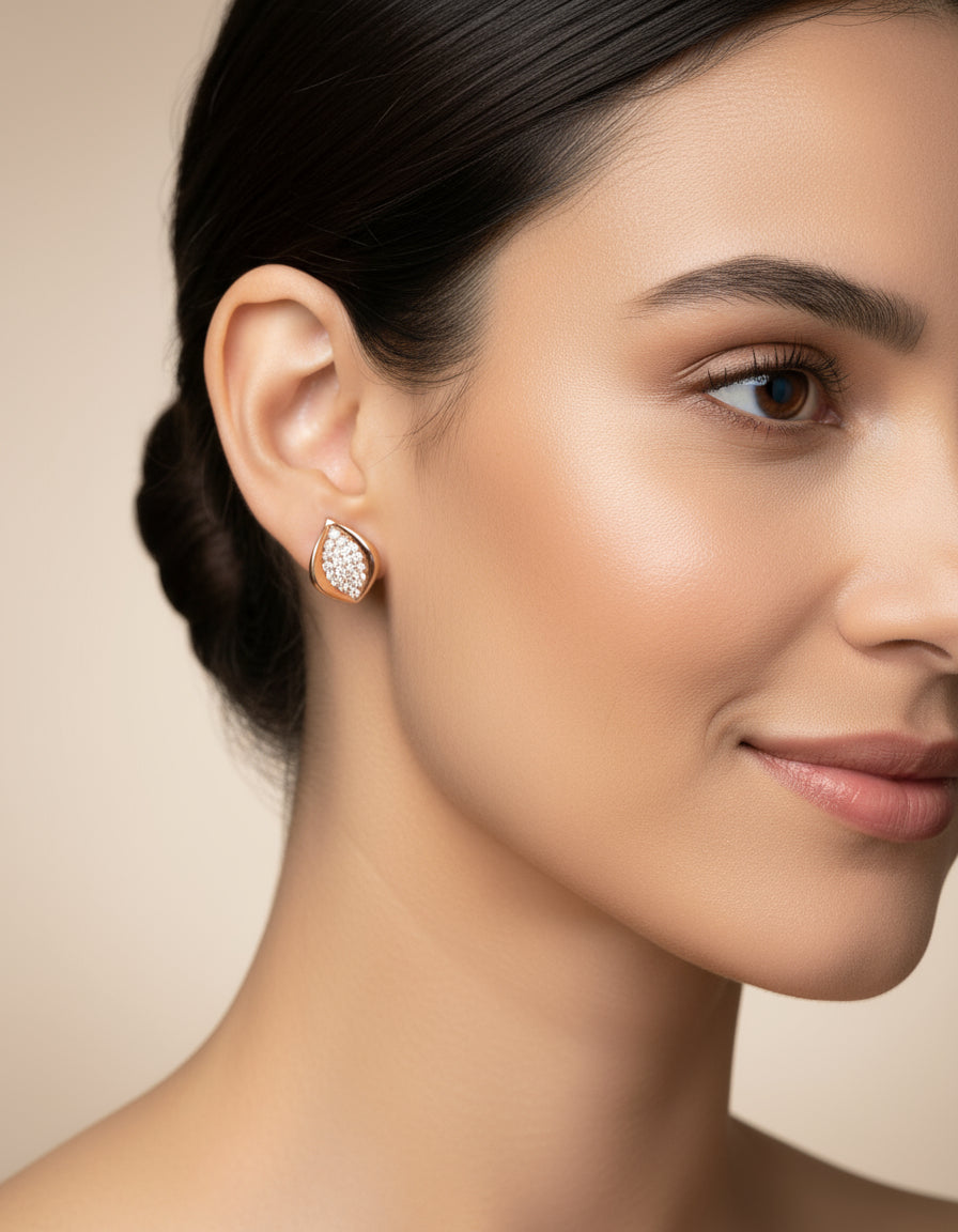 Buy women’s silver stud earrings with a rose-gold finish and sparkling pavé stone detailing online.