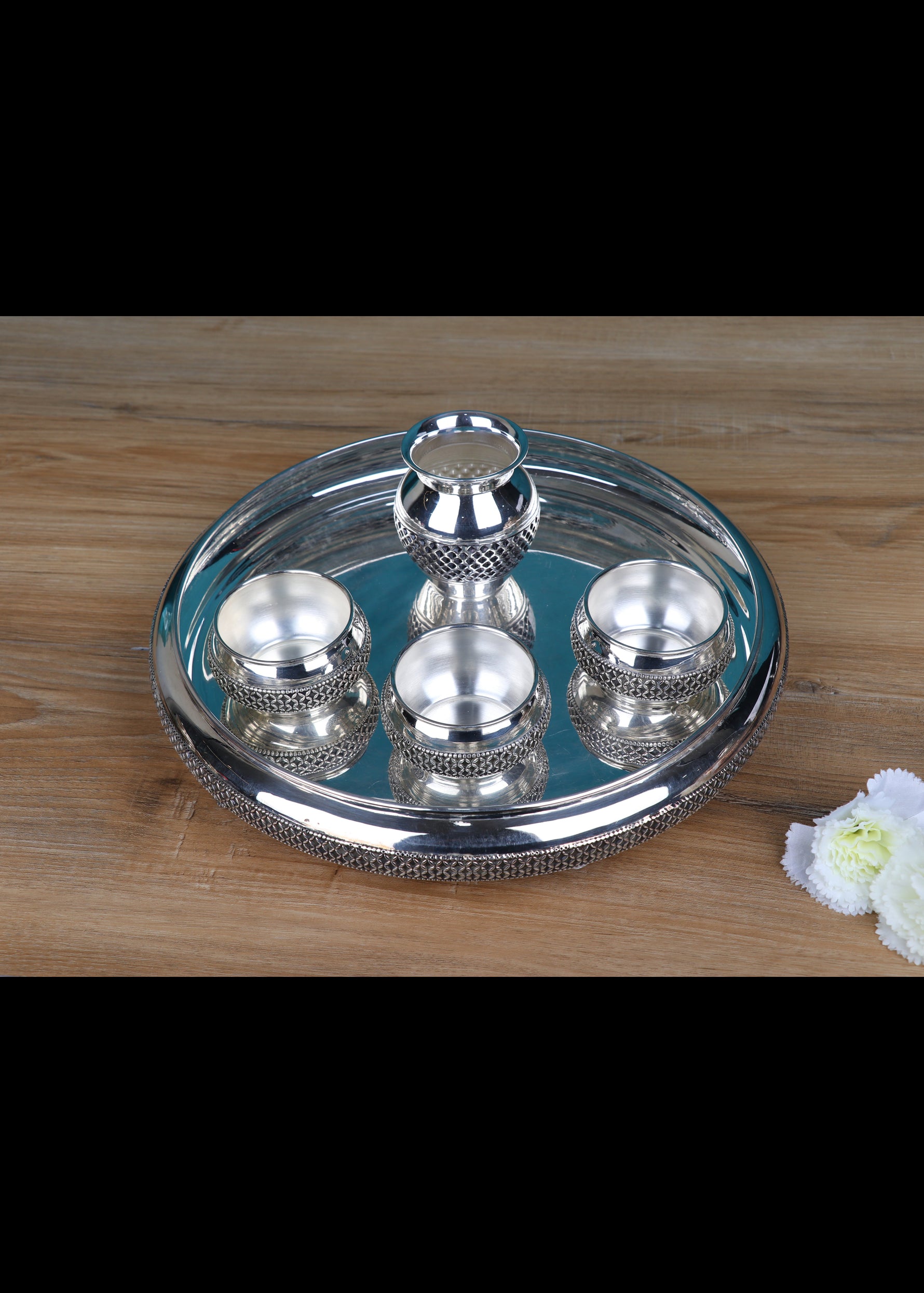 Silver-plated pooja thali set with kalash centerpiece and four small bowls on round tray
