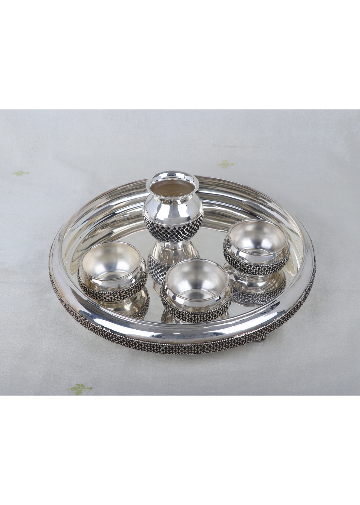 Silver-plated pooja thali set with kalash finial and four bowls on round tray