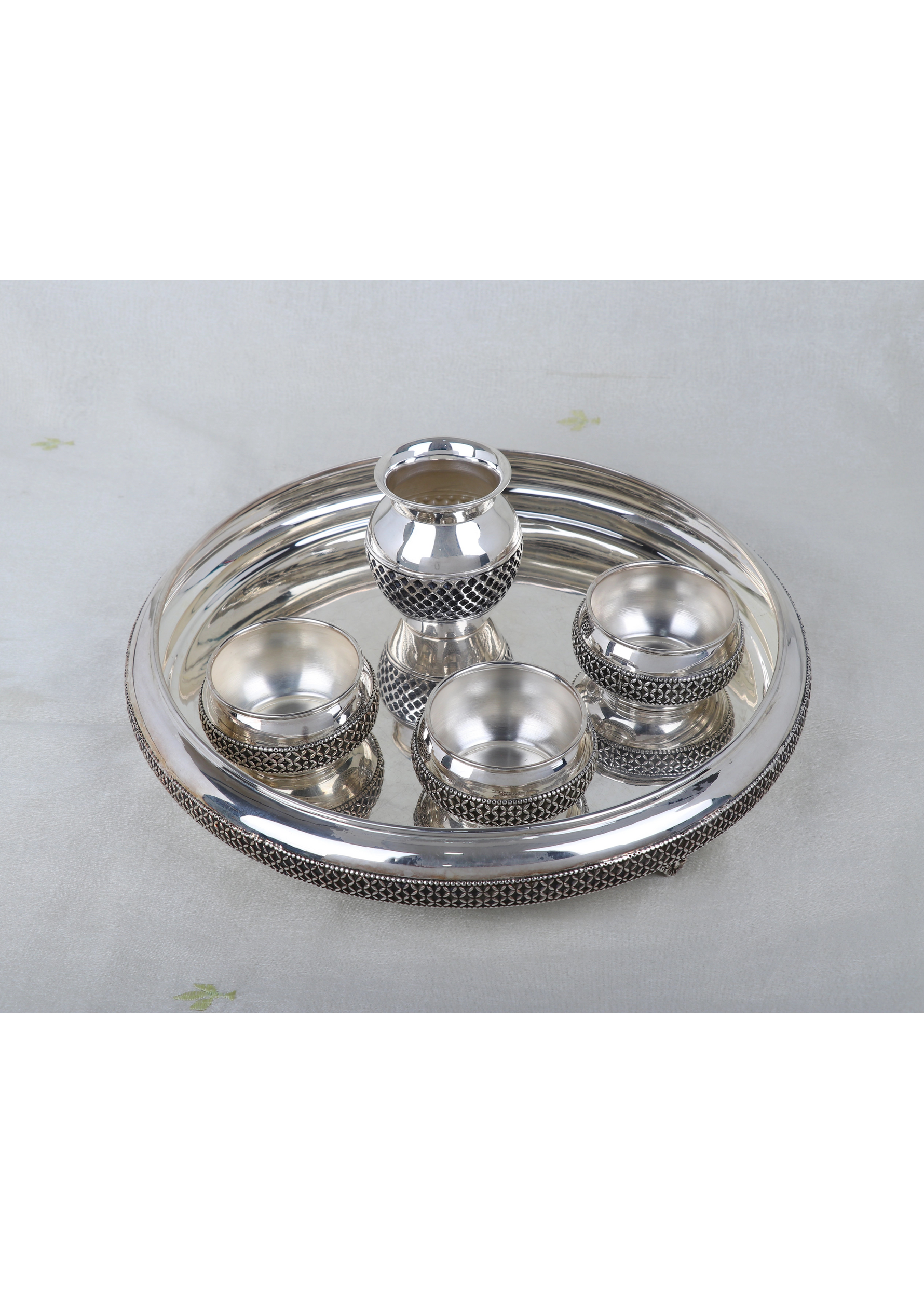 Silver-plated pooja thali set with kalash finial and four bowls on round tray
