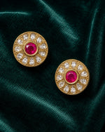 Designer silver earrings for women in round floral stud style with pink stone and crystal accents.