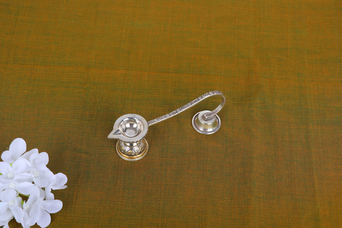 Silver-plated aarti diya oil lamp, close top view of both cup holders