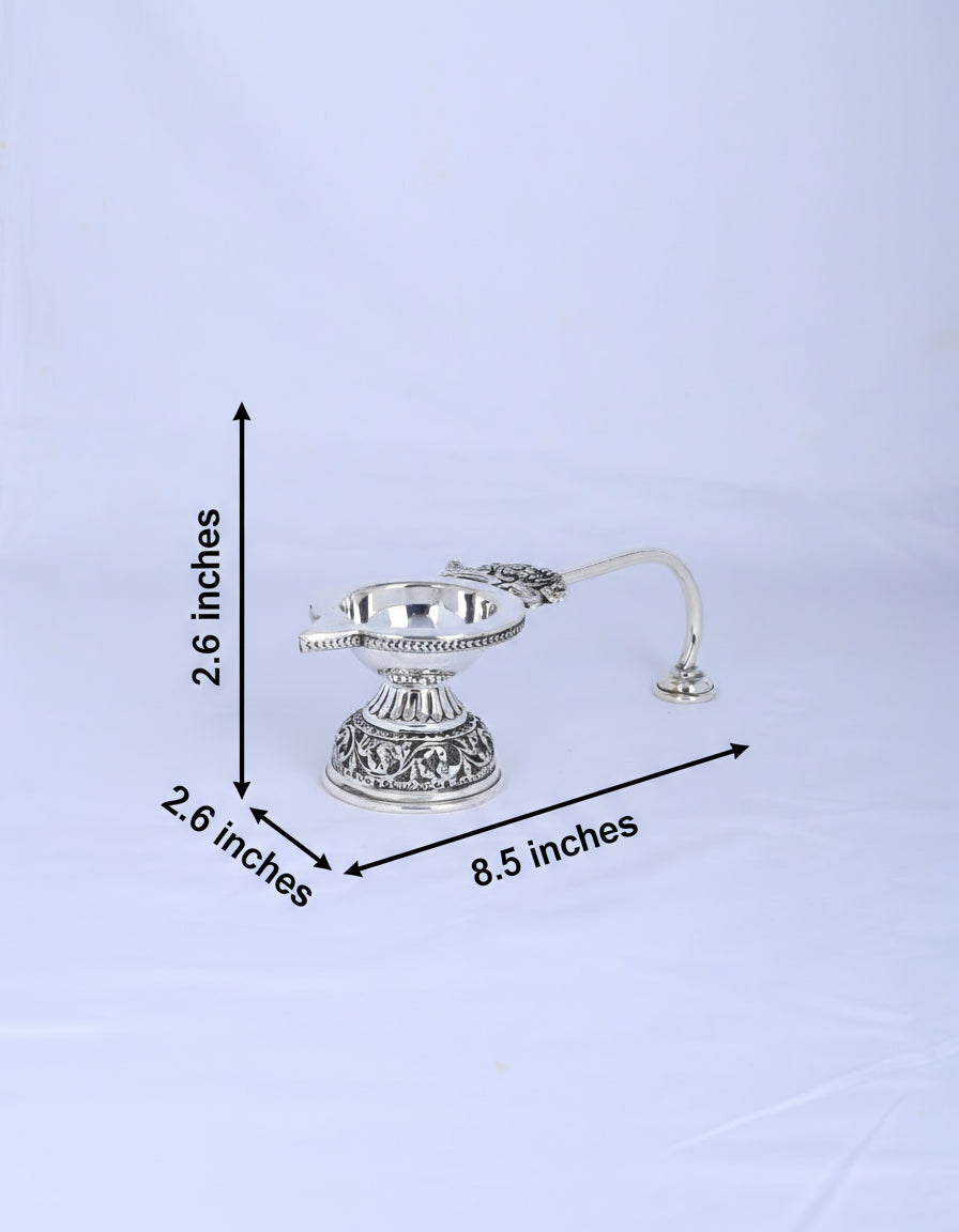 Small 925 silver aarti diya with handle and round flame bowl on ornate stand