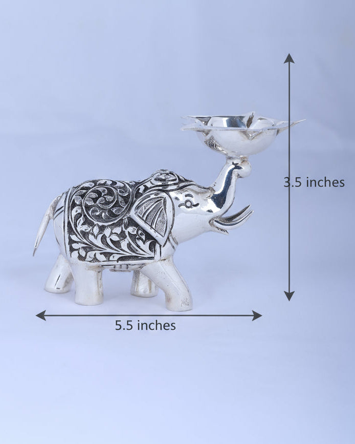 Decorative 925 silver elephant diya figurine with carved details and lit-holder bowl