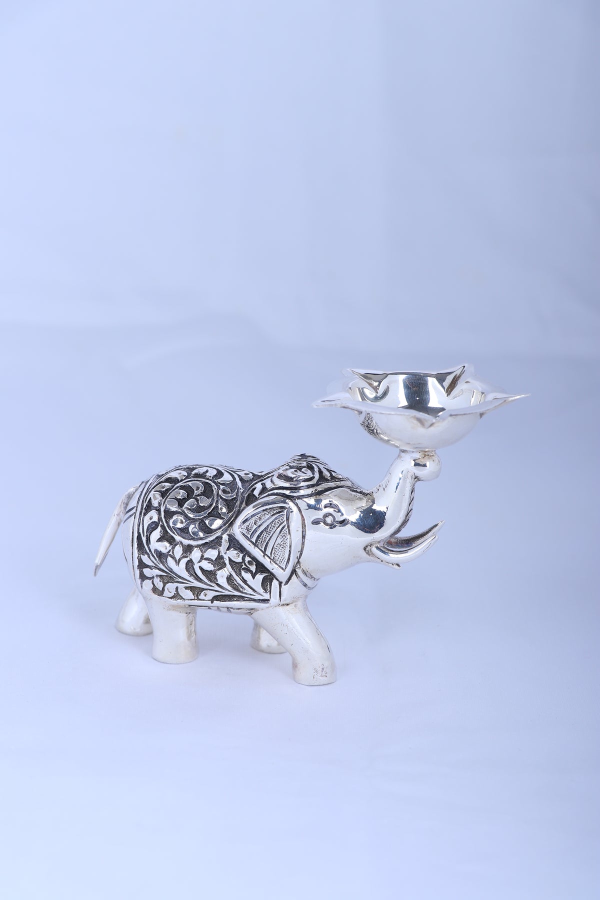 Small 925 silver elephant diya with engraved texture and raised diya bowl on back