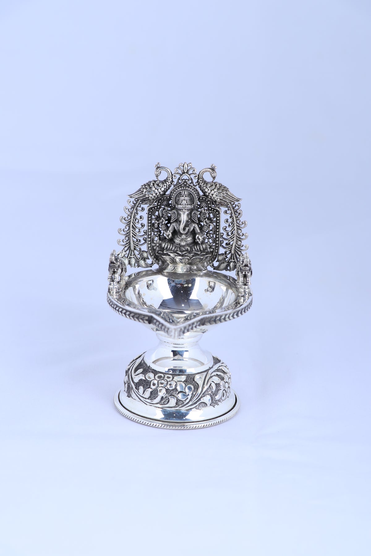 925 silver Ganesha diya lamp with ornate back panel and reflective pedestal base