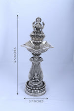 Silver deity diya stand, 12.5 in tall with decorative tiered base and lamp plate