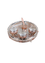 Silver-tone pooja thali with five small cups and a center raised holder