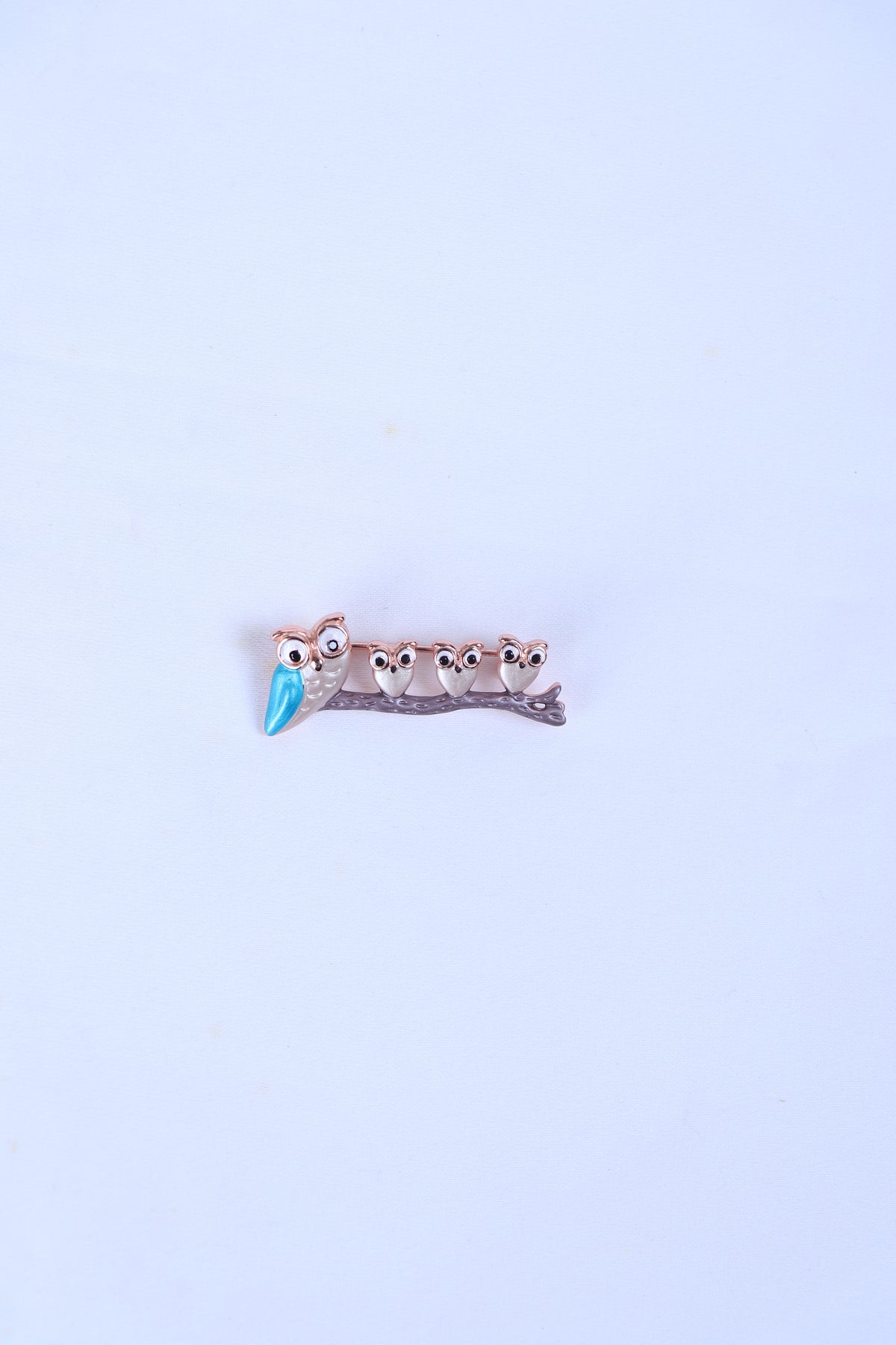 Silver-tone five-owl brooch with blue beaks on small bar