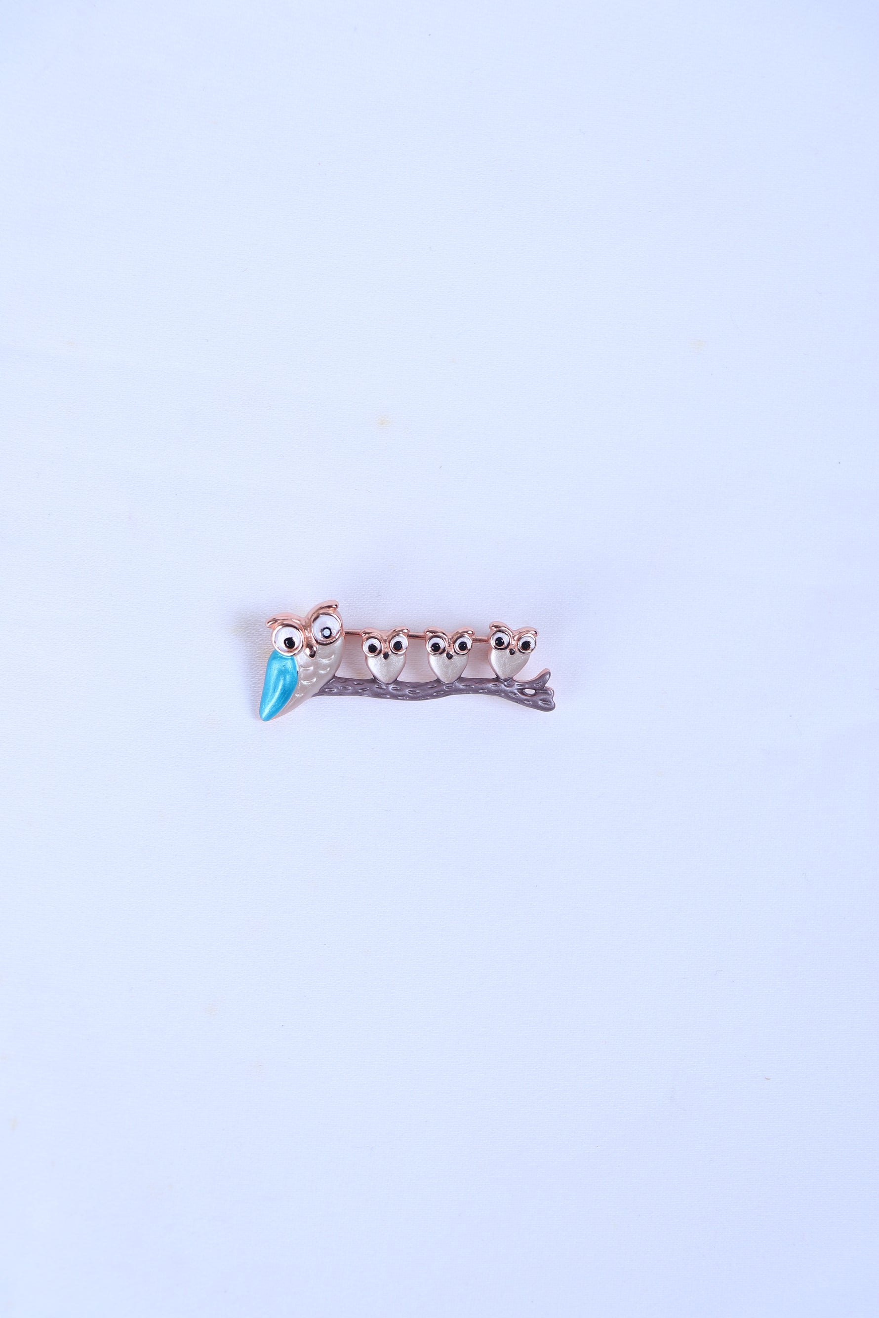 Silver-tone five-owl brooch with blue beaks on small bar