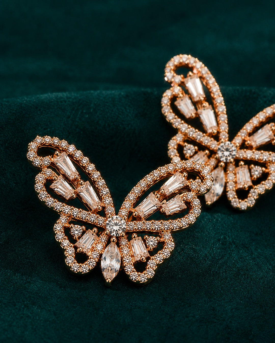 Pure silver butterfly stud earrings featuring clear baguette stones and delicate crystal detailing.