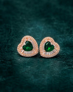 Pure silver earrings for women featuring an emerald-green centre stone surrounded by clear crystals.