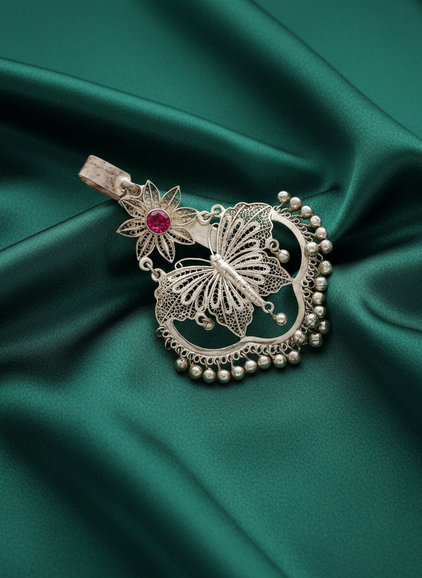 925 silver filigree key ring charm close-up with red stone and pearl-like bead accents