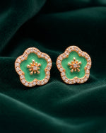 Pure silver earrings for women with floral green stone design and crystal detailing.