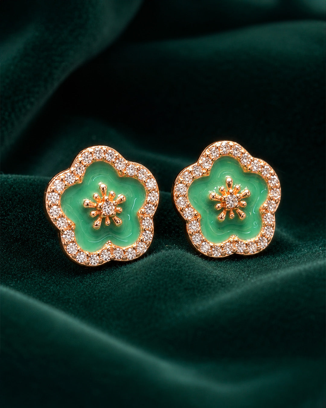 Pure silver earrings for women with floral green stone design and crystal detailing.