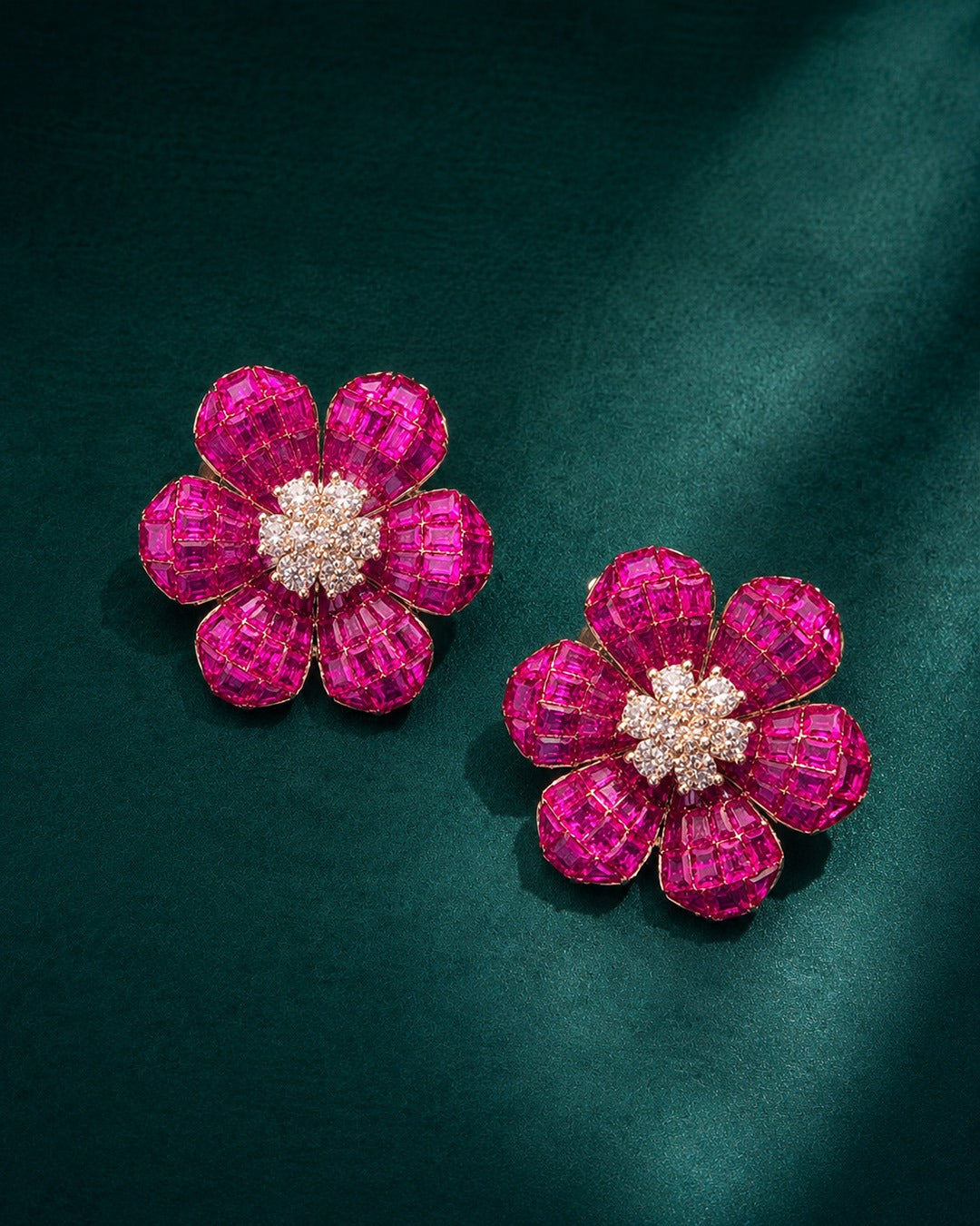 Pure silver flower stud earrings featuring vibrant pink stones and a sparkling crystal cluster centre.