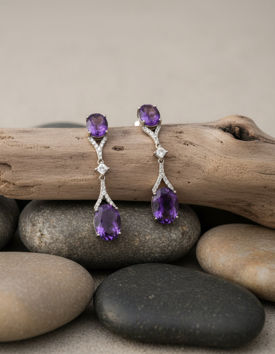 Pure silver long dangle earrings for women featuring two purple stones and delicate clear crystal accents.