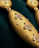 Pure silver drop earrings for women with elegant gold finish and floral motif.