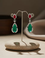 Pure silver long earrings for women featuring red and green teardrop stones with sparkling crystal borders.