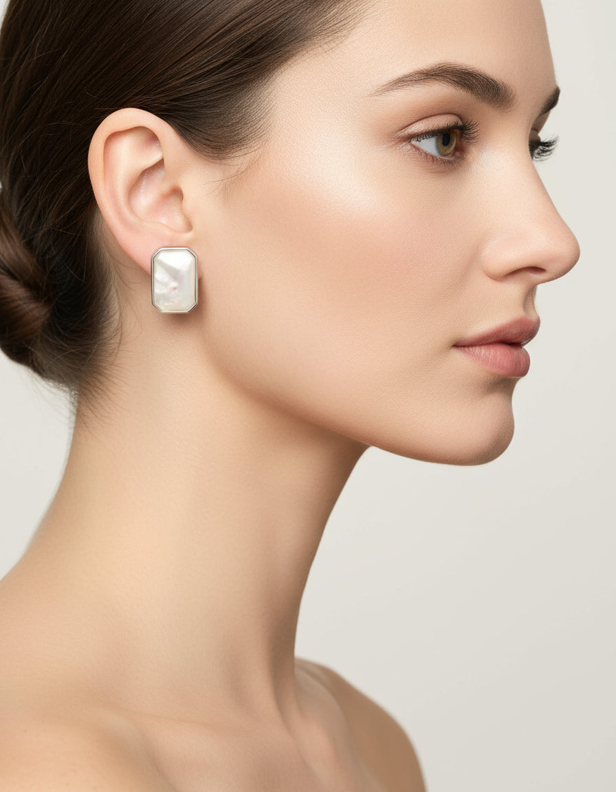 Pure silver rectangular stud earrings for women featuring a luminous mother-of-pearl surface.