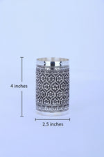 Silver fluted tumbler with dark patterned band and engraved details