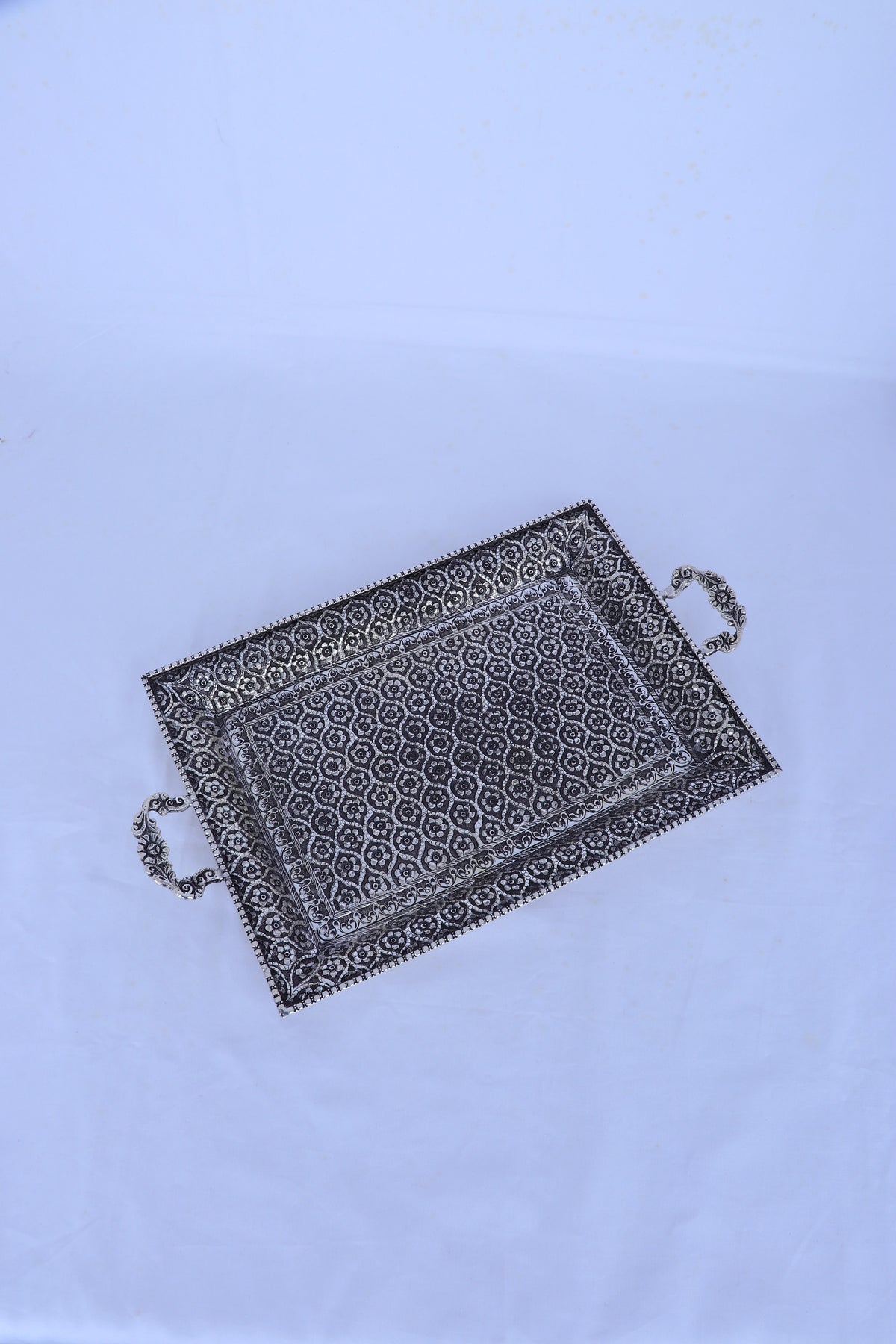 Rectangular silver tray with geometric engraving and two side handles