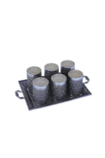 Silver fluted tumbler set with patterned cups arranged on tray