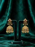 Silver earrings with red gemstones with gold coloring
