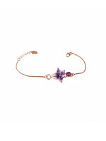 Rose gold bracelet with a purple flower charm