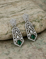 Shop crystal-studded silver earrings for women with an elegant long design and green teardrop accents.