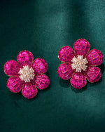 Shop designer silver stud earrings for women with bright pink stones and clear crystal detailing.
