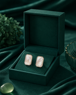 Shop modern silver stud earrings for women with an octagonal frame and mother-of-pearl centre.