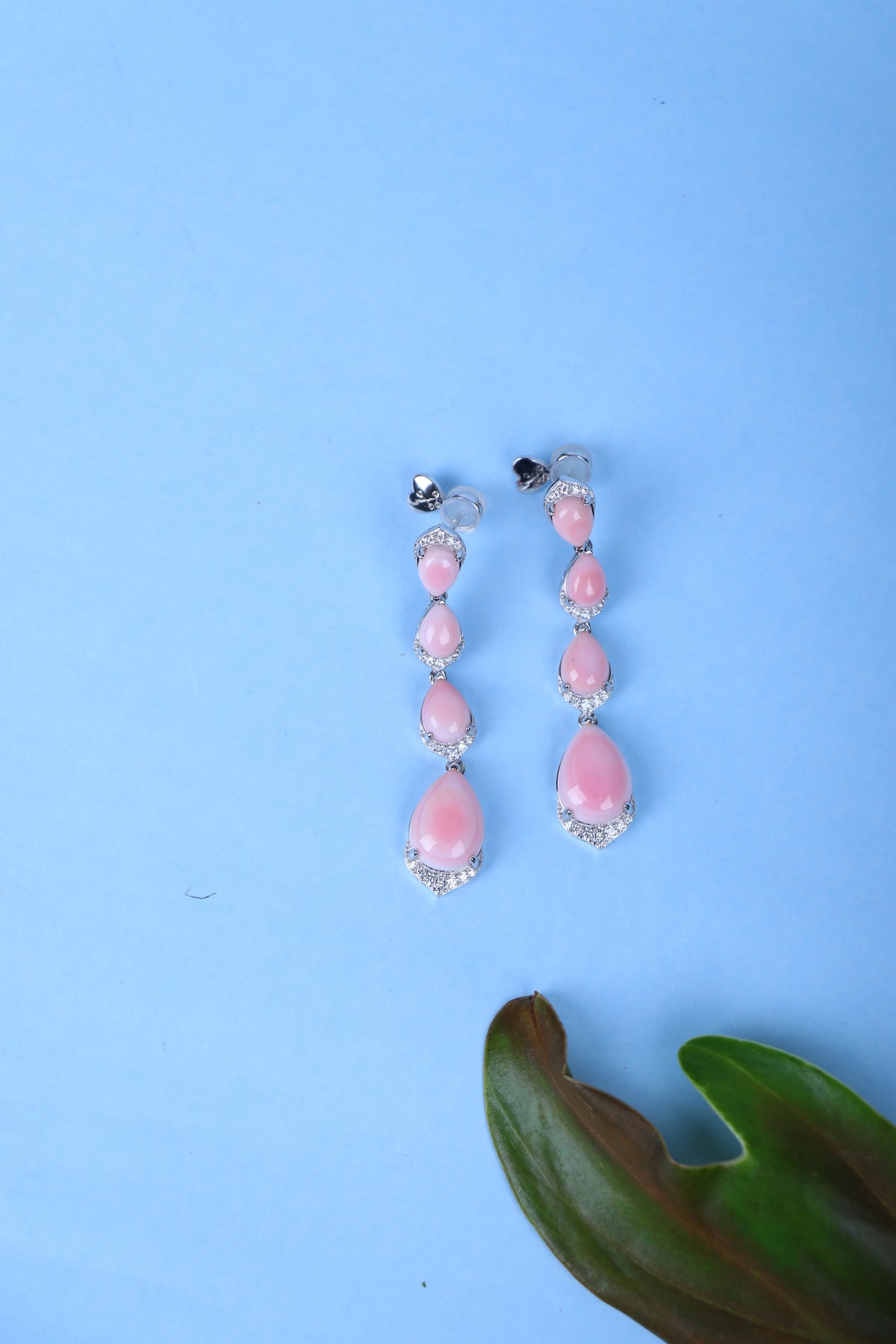 Buy pink teardrop silver earrings for women.