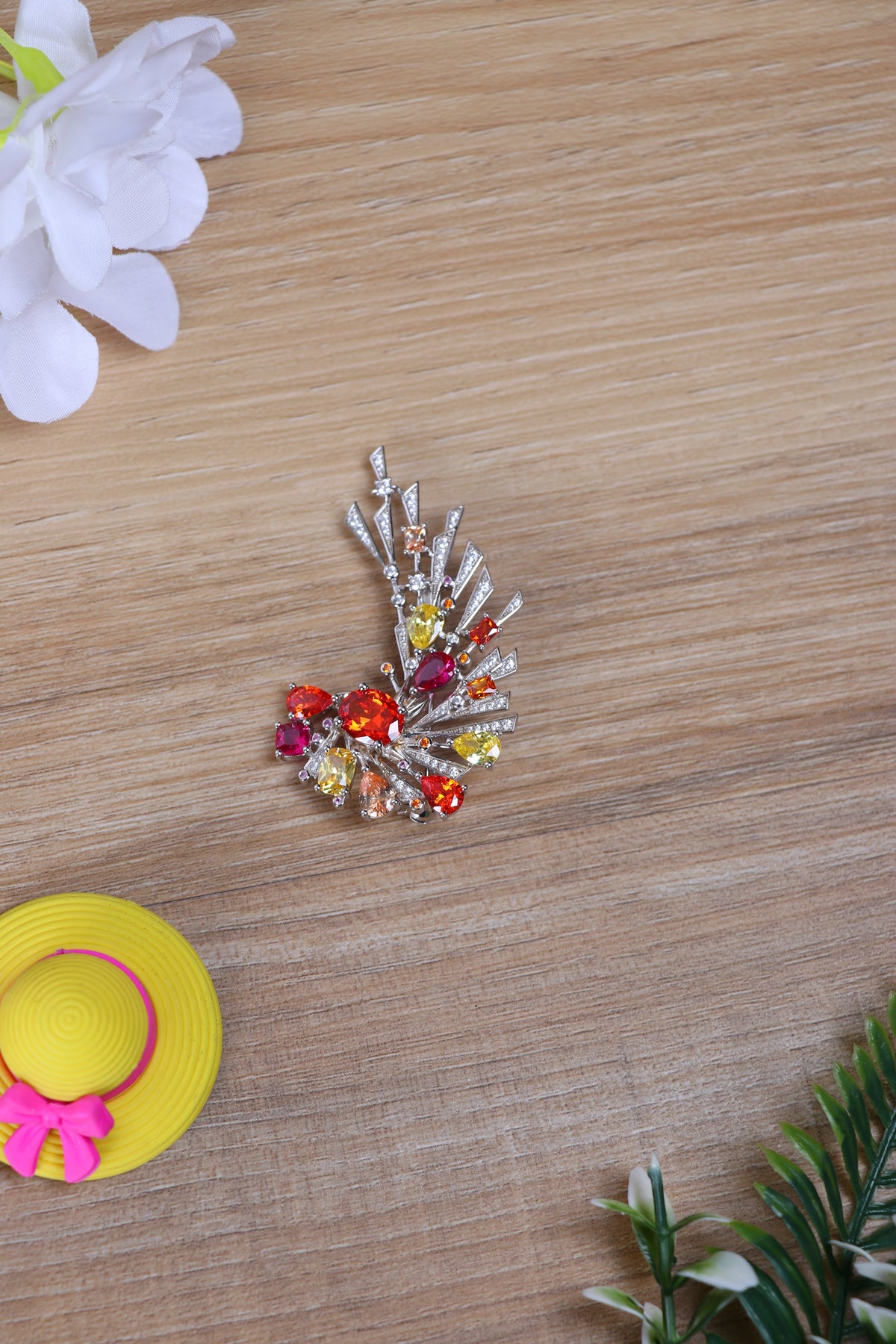 Shop silver brooch online featuring a peacock-inspired design with sparkling crystals.
