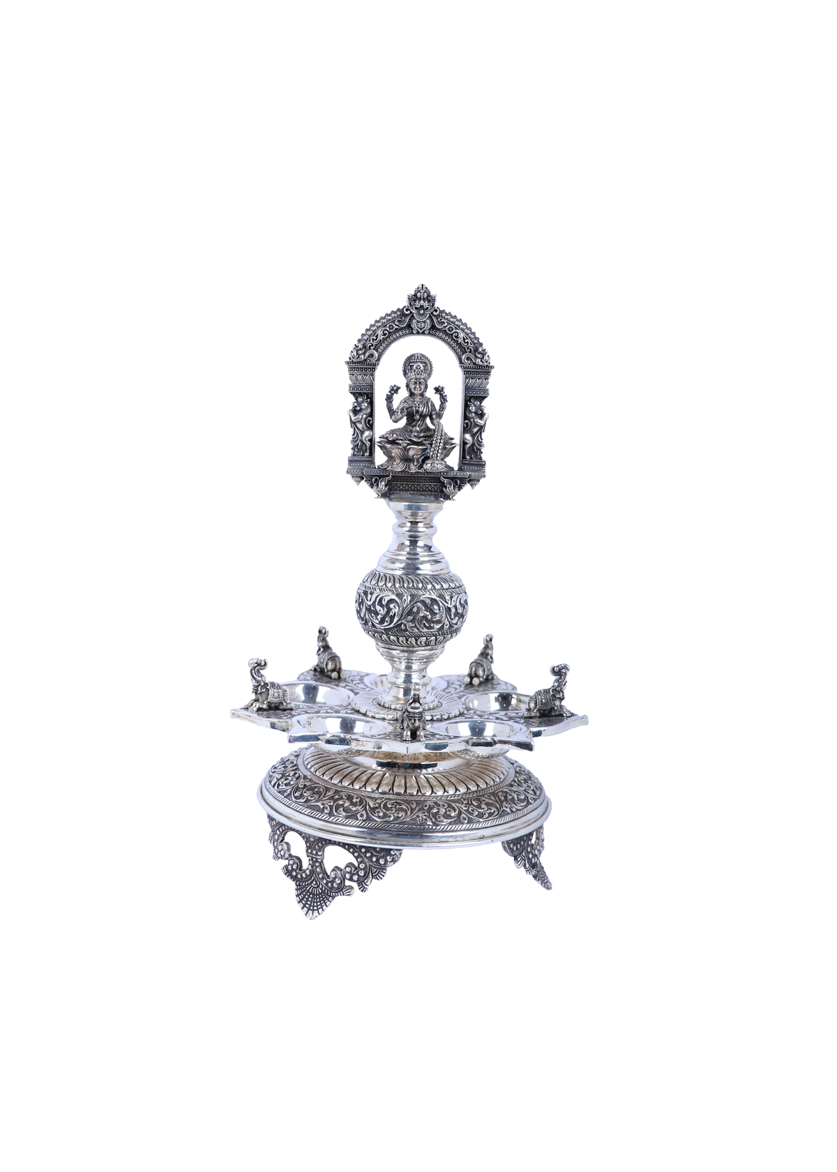 Ornate silver-tone temple diya set with Lakshmi relief, multi-tier base and central stem