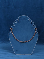 Silver-tone necklace chain with multicolor link accents on a display bust