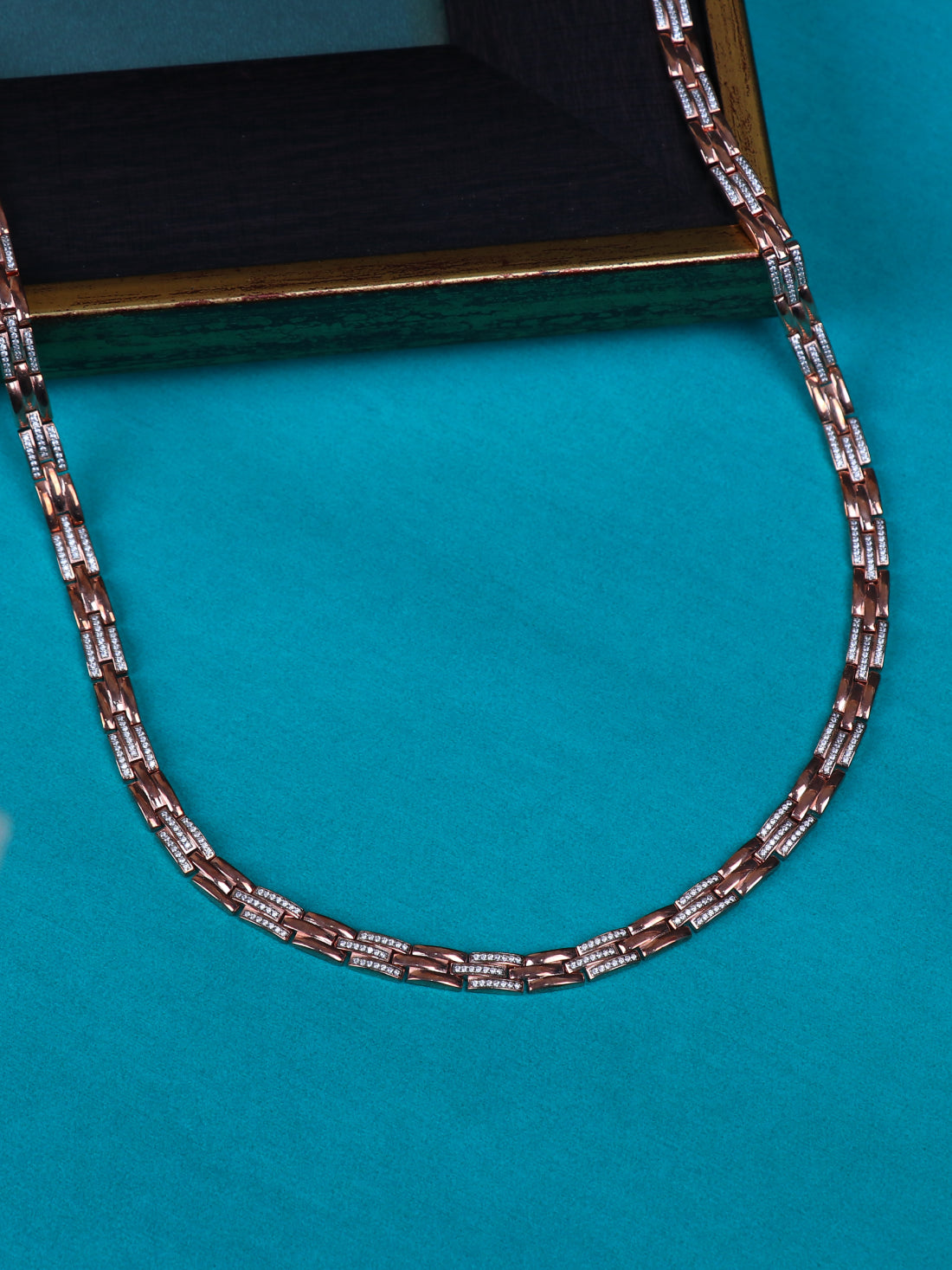 Close-up of silver-tone chain necklace with multicolor link accents